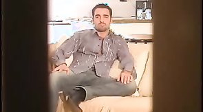 Awesome-looking hunk jerking his hard dick in bedroom