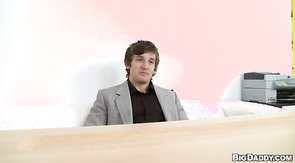 Man in the suite slowly undressing on the hidden camera