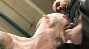 Tattooed bald male is blowing a massive hard sausage