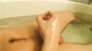 Naked young boyfriend is playing with his cock in the bathroom