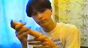 Skinny youngster shoves a huge dildo in his anal