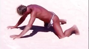 Beach Striptease: Tanned Hunk Bares All