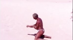Beach Striptease: Tanned Hunk Bares All