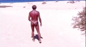 Beach Striptease: Tanned Hunk Bares All
