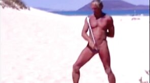 Beach Striptease: Tanned Hunk Bares All