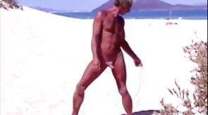 Beach Striptease: Tanned Hunk Bares All