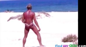 Beach Striptease: Tanned Hunk Bares All