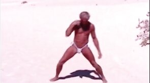 Beach Striptease: Tanned Hunk Bares All