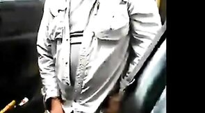 Bearded daddy strokes his cock by his truck outdoors.