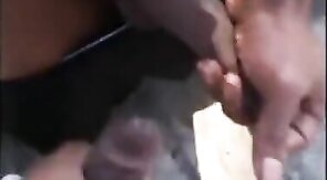 Black amateurs stroke big cocks outdoors