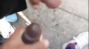 Black amateurs stroke big cocks outdoors