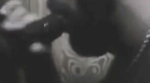 Black Hunk Sucks Big Cock Through Glory Hole