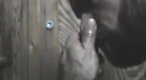 Black Hunk Sucks Big Cock Through Glory Hole
