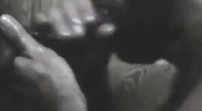 Black Hunk Sucks Big Cock Through Glory Hole