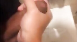Hardcore Action in the Bathroom with Gaping and Handjobs