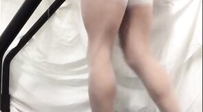 Crossdresser in White Stockings on Treadmill