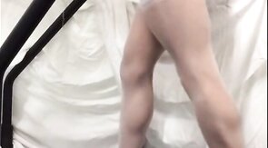 Crossdresser in White Stockings on Treadmill