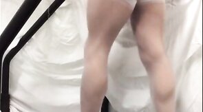 Crossdresser in White Stockings on Treadmill