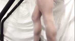 Crossdresser in White Stockings on Treadmill