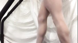Crossdresser in White Stockings on Treadmill