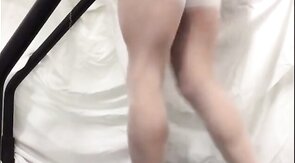 Crossdresser in White Stockings on Treadmill