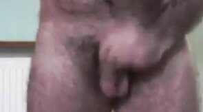 Hairy Daddy Strokes His Cock