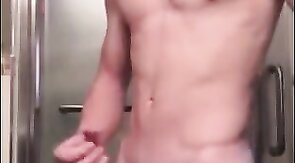 Muscular Twink Strokes His Big Cock in Bathroom Solo