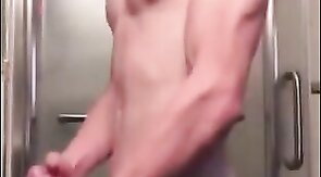 Muscular Twink Strokes His Big Cock in Bathroom Solo