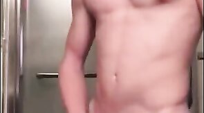 Muscular Twink Strokes His Big Cock in Bathroom Solo