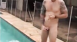 Muscular Hunk Jerks Off by the Pool with a Cigarette