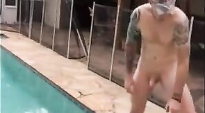 Muscular Hunk Jerks Off by the Pool with a Cigarette