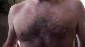 Hairy bear daddy strokes his meat