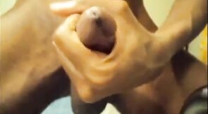 Black guy jacks off his big cock and cums hard