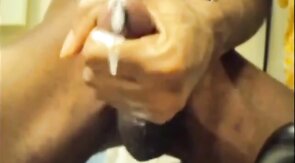 Black guy jacks off his big cock and cums hard