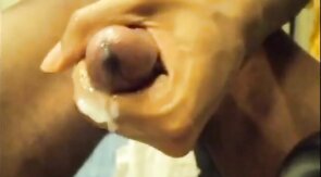 Black guy jacks off his big cock and cums hard