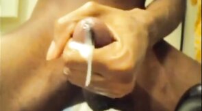 Black guy jacks off his big cock and cums hard