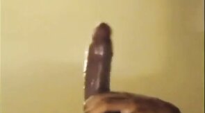 Black guy jacks off his big cock and cums hard