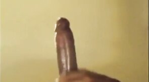 Black guy jacks off his big cock and cums hard