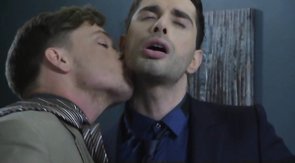 Four muscled officer workers are enjoying oral sex