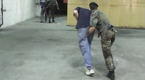Two crazy soldiers are playing with their victim