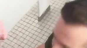 Hunk gives blowjob in a public restroom - amateur gay porn