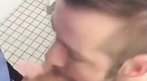 Hunk gives blowjob in a public restroom - amateur gay porn