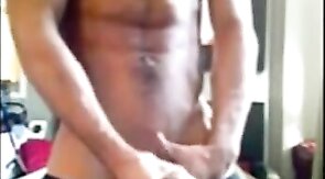 Muscular amateur strokes his big cock and explodes!