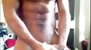 Muscular amateur strokes his big cock and explodes!