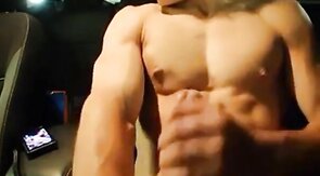 Big-Cocked Man Strokes in Car While Watching Porn