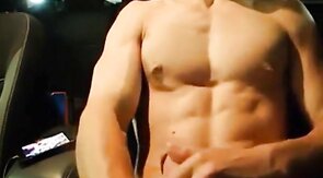 Big-Cocked Man Strokes in Car While Watching Porn