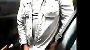 Bearded daddy strokes his cock by his truck outdoors.