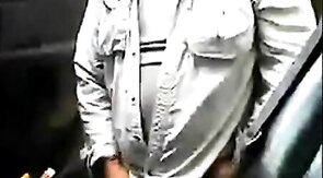 Bearded daddy strokes his cock by his truck outdoors.