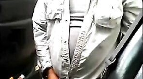 Bearded daddy strokes his cock by his truck outdoors.