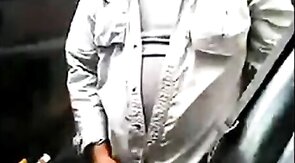 Bearded daddy strokes his cock by his truck outdoors.